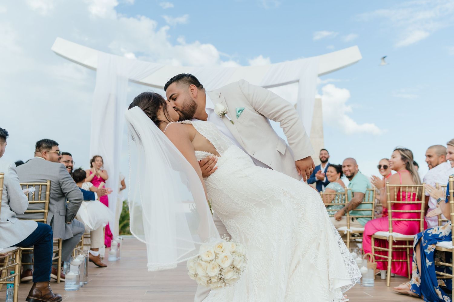 First kiss after a wedding ceremony at Majestic Elegance Costa Mujeres in the Riviera Maya.