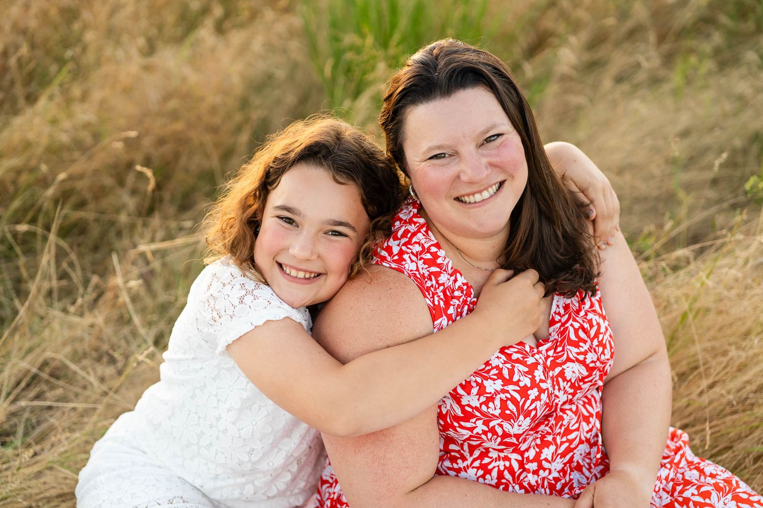 Daughter hugs mom.