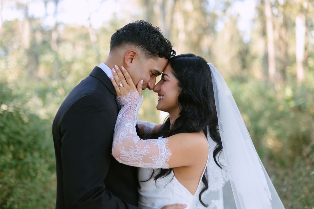 bride and groom embracing touching faces at barn wedding at the ranch 22 in lake worth
