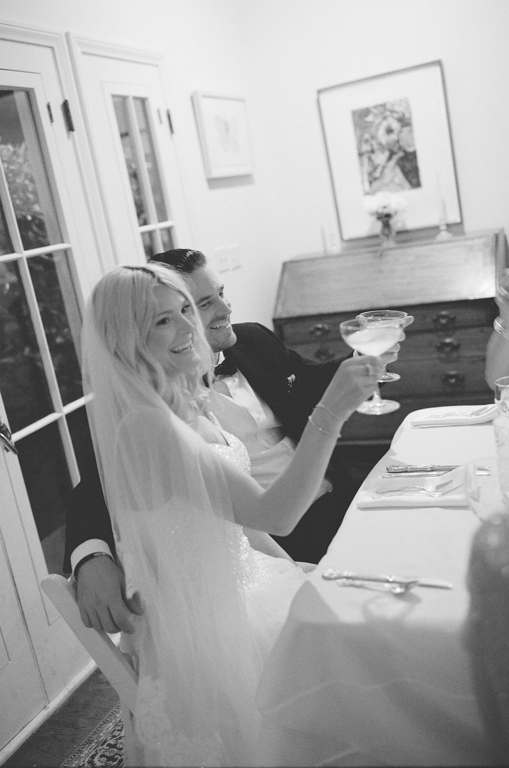 Candid party shots and toast energy on 35mm film for an indie North Carolina wedding celebration.