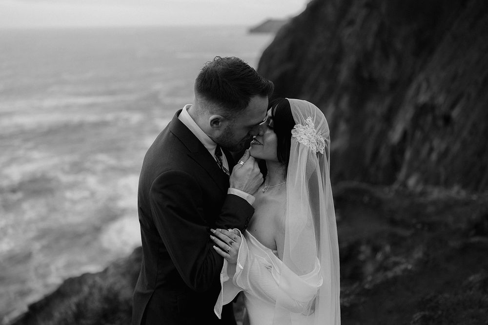 Black and white photo of a couple sharing an intimate moment during their Elk Flats Trail elopement