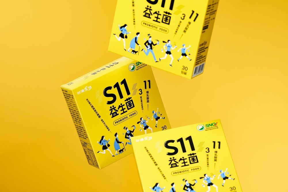 Three yellow boxes of S11 probiotic supplement floating against a bright yellow background with Chinese characters.