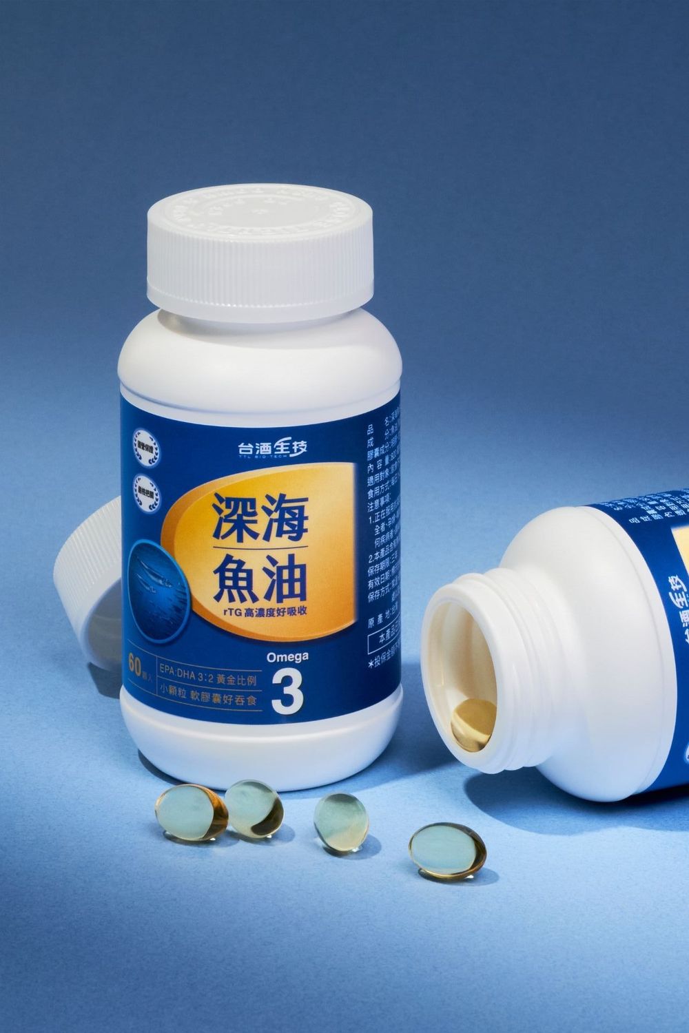 Taiwan deep sea fish oil Omega-3 supplement bottle with soft gel capsules on blue background.