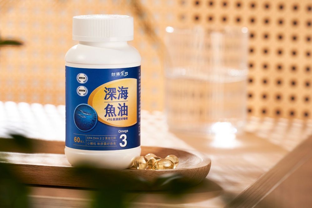 Deep sea fish oil omega-3 supplement bottle on wooden tray with warm natural background.