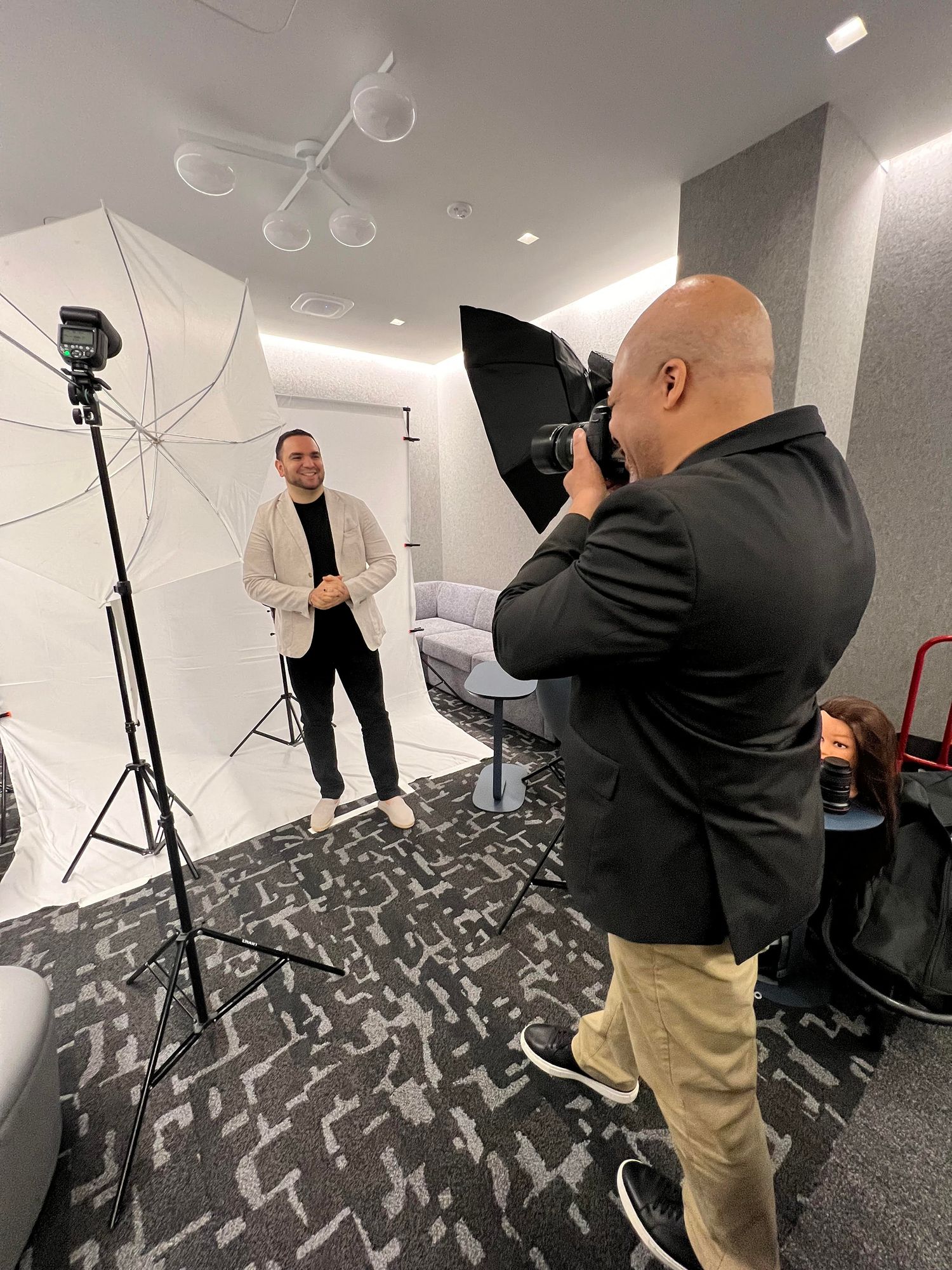 Headshot Photographer Kent Daniel photographing a businessman