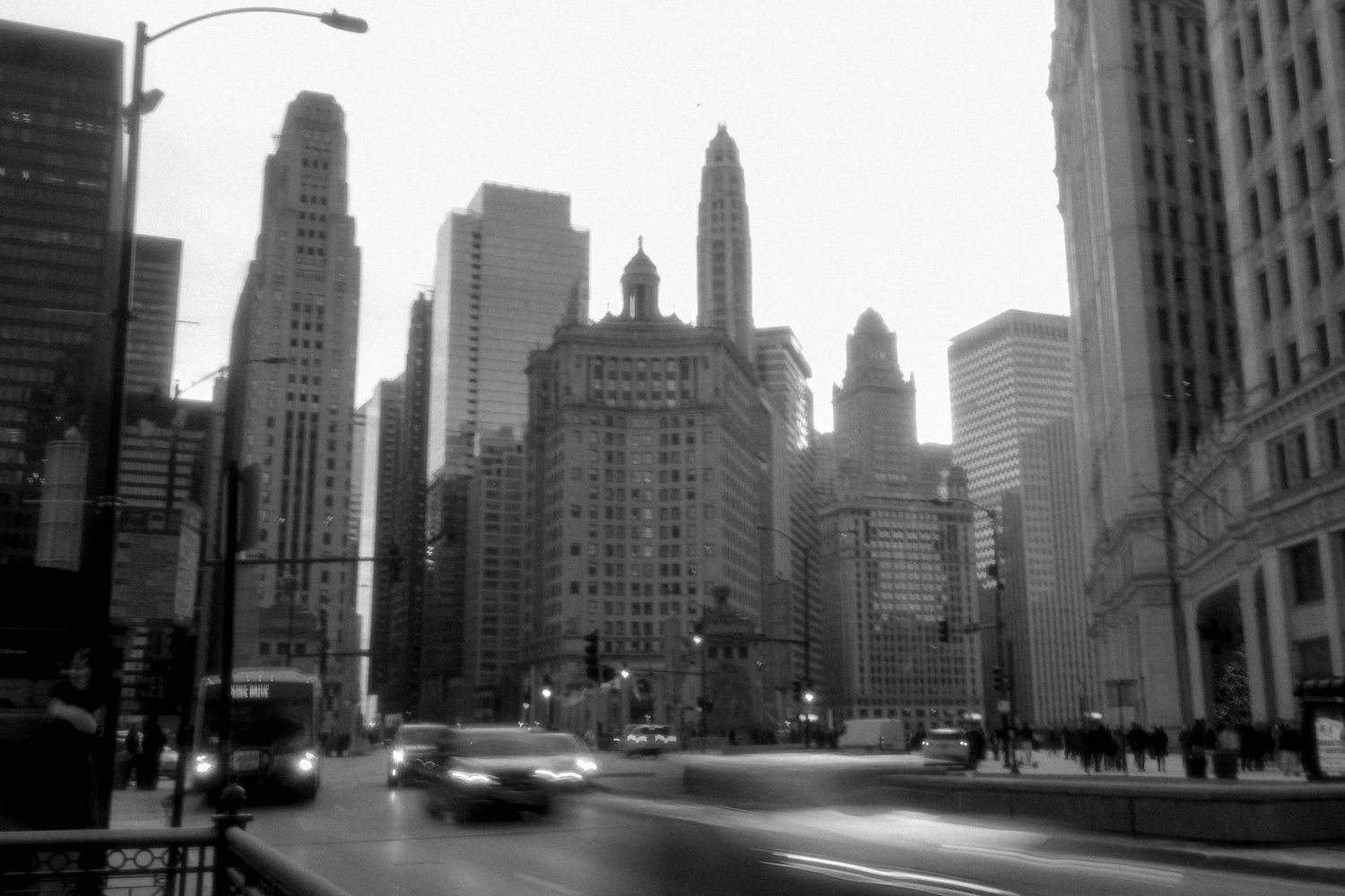 Fast Cars driving through downtown Chicago in black & white.