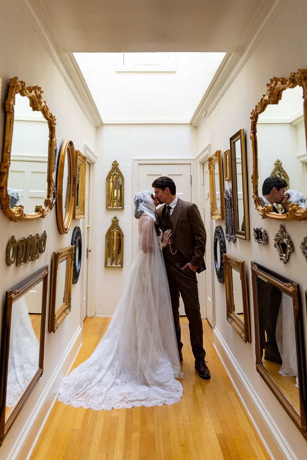 bride and groom in the hallway of mirrors at the thornewood castle wedding venue