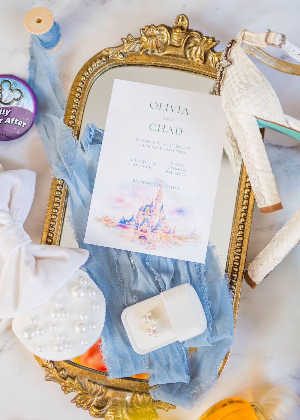Disney-inspired wedding photography featuring romantic details & elegant styling. Magical Flatlay invitation captured in Central Florida.