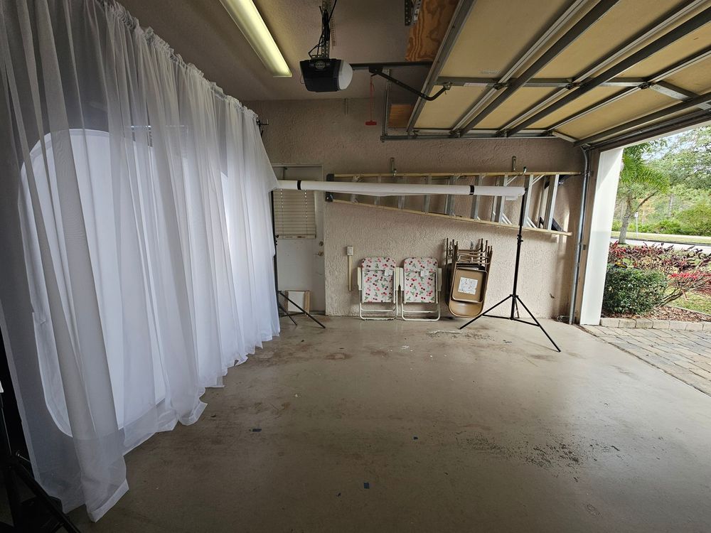 Interior view of an empty commercial space under construction with exposed ceiling ducts and concrete floors.