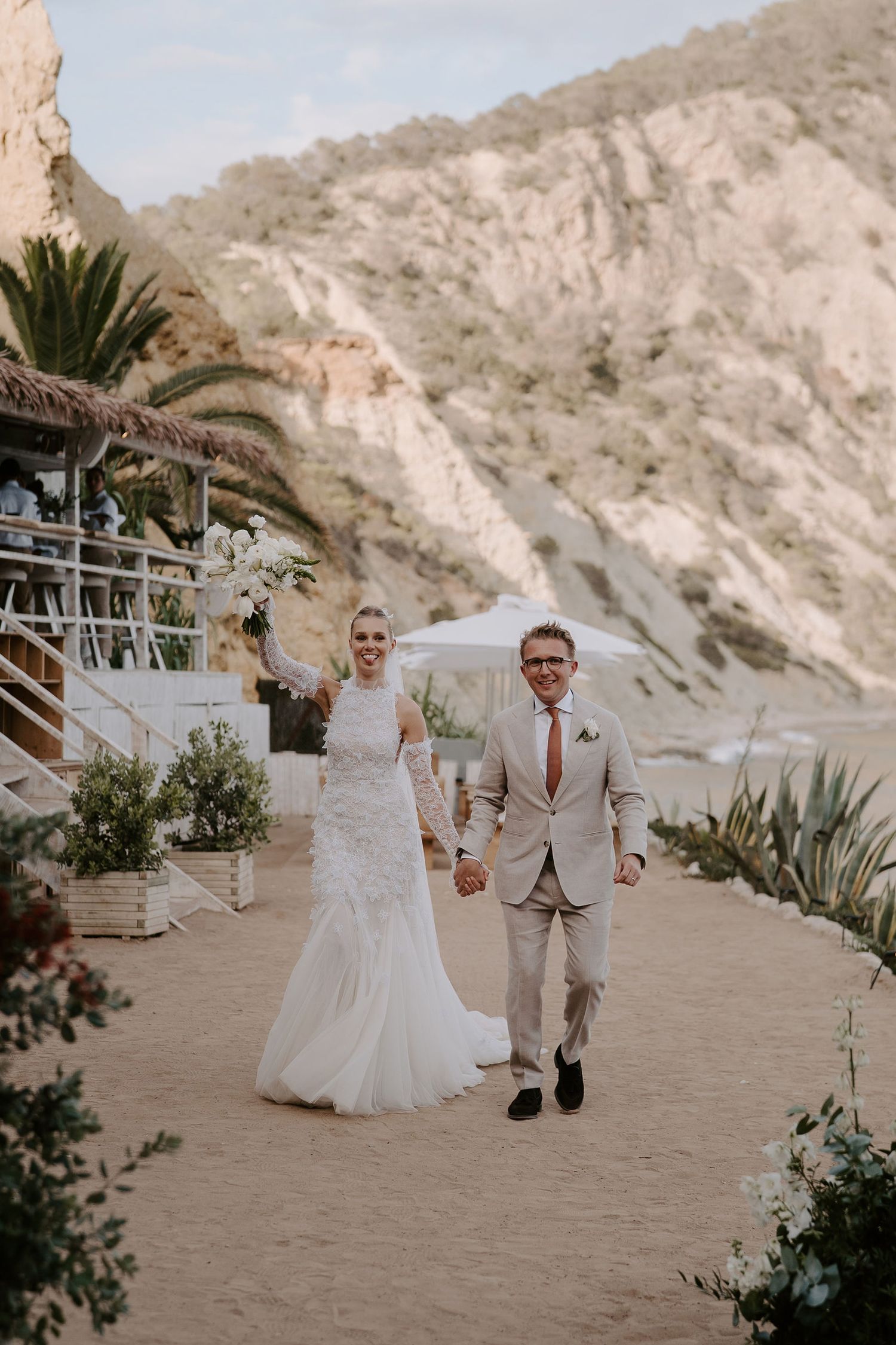 bride and groom entering wedding meal at amante ibiza