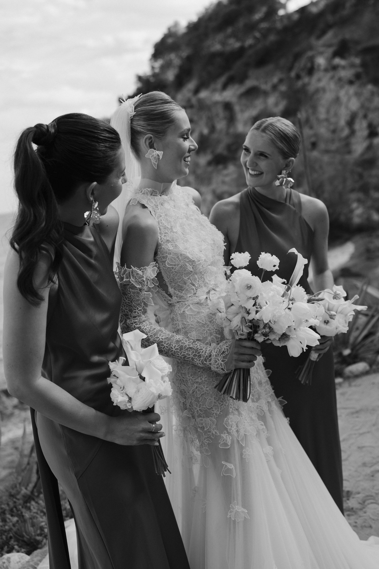 bride and bridesmaids smiling at each other in Amante Ibiza