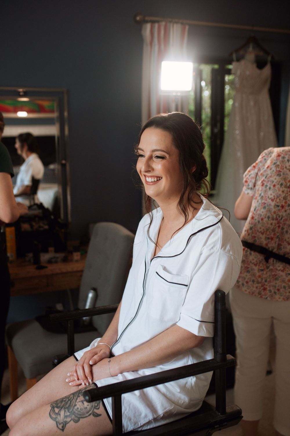 Getting ready moments in a modern salon with natural lighting.