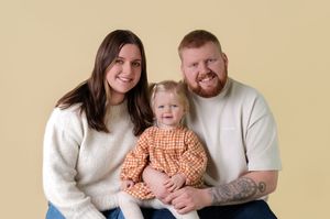 A series of five family portraits showing parents with a young child in matching white and orange outfits.