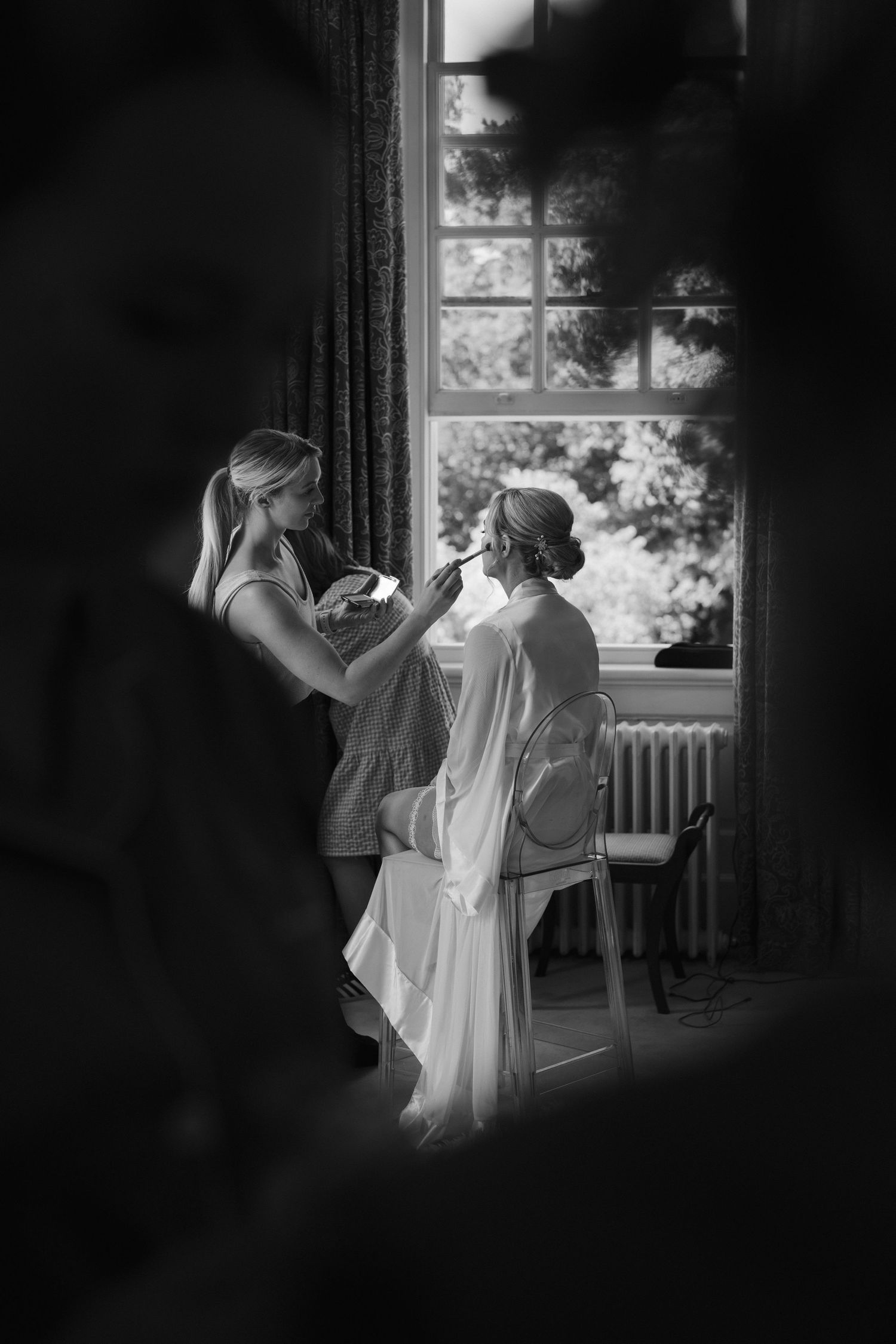 bride sitting in makeup at Iscoyd park