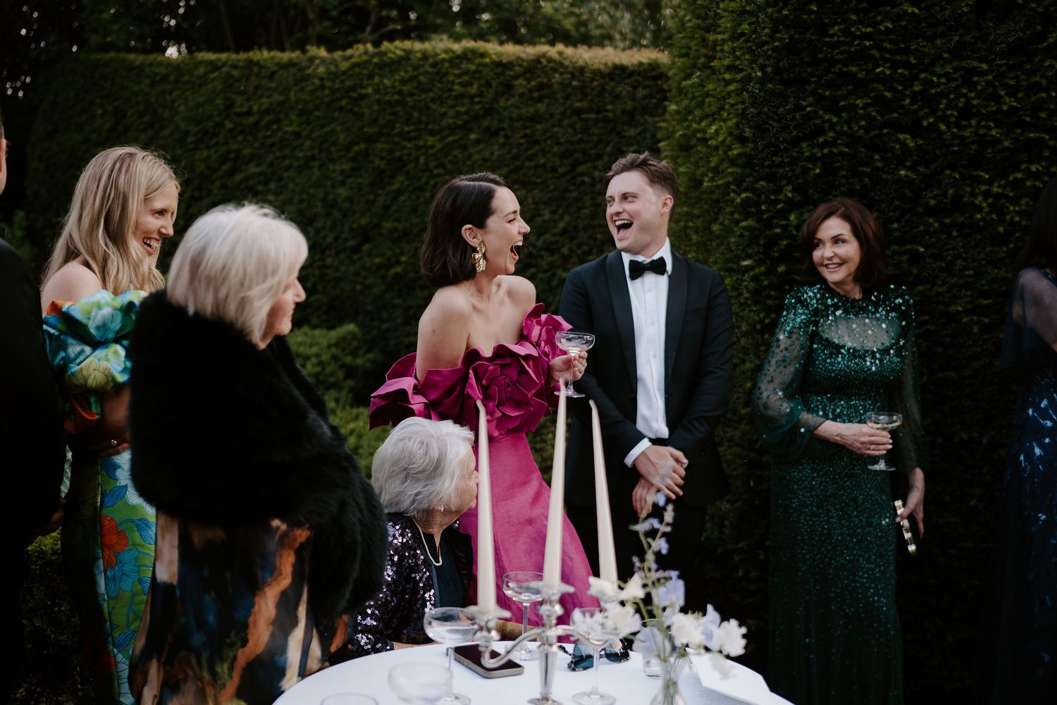 wedding guests laughing at father of the brides speech at dewsall court in herefordshire