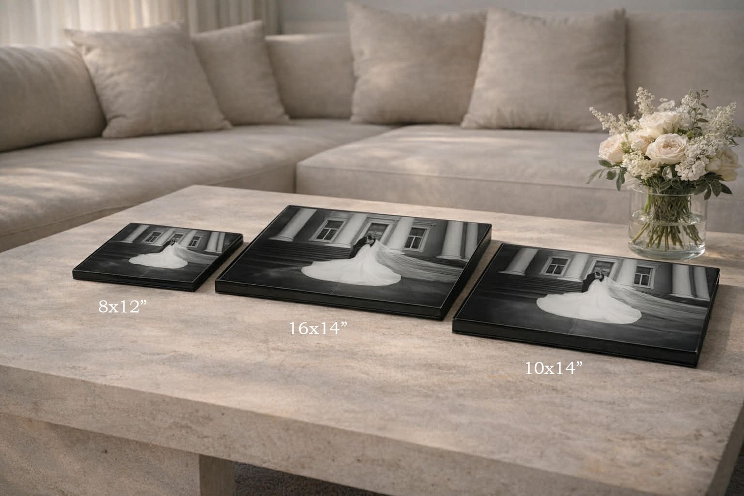 Three black and white wedding canvas prints displayed in sizes 8x12, 16x14, and 10x14 on a coffee table.