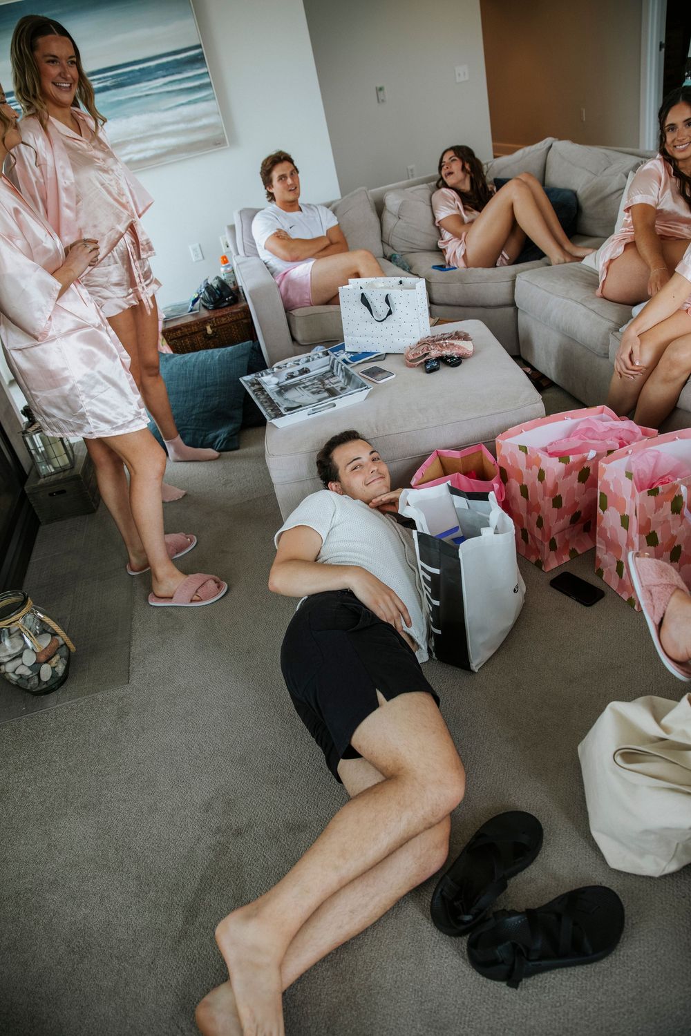 The bridal party lounge around before the ceremony in matching robes