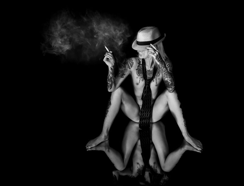 A collection of black and white artistic photographs showing hands holding musical instruments and dramatic poses.