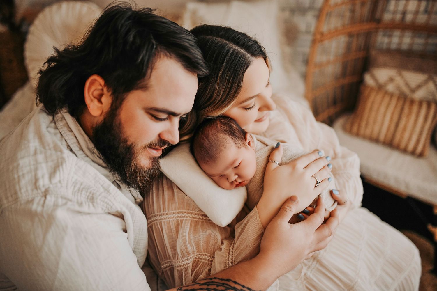 Parents holding their newborn baby during a relaxed lifestyle family session