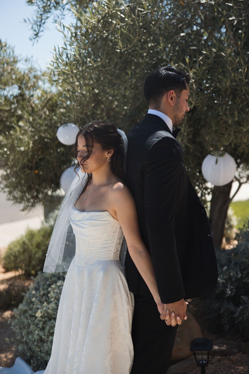 First touch moment between bride and groom before their Ventura wedding