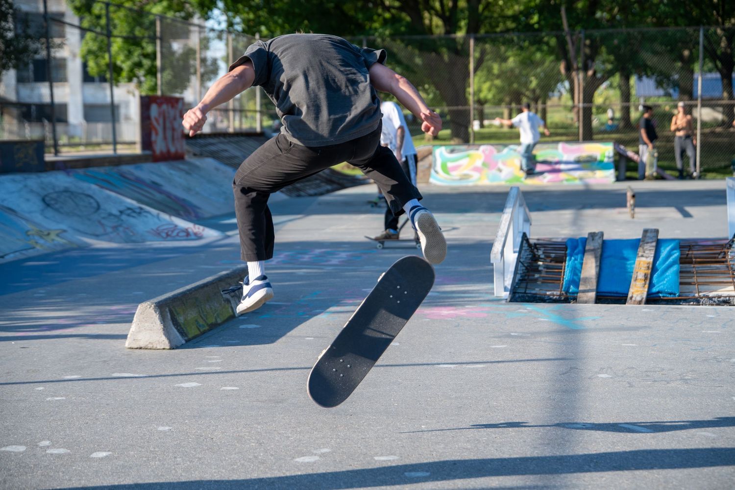 Close-up action shots of skateboarding tricks at a concrete skate park.