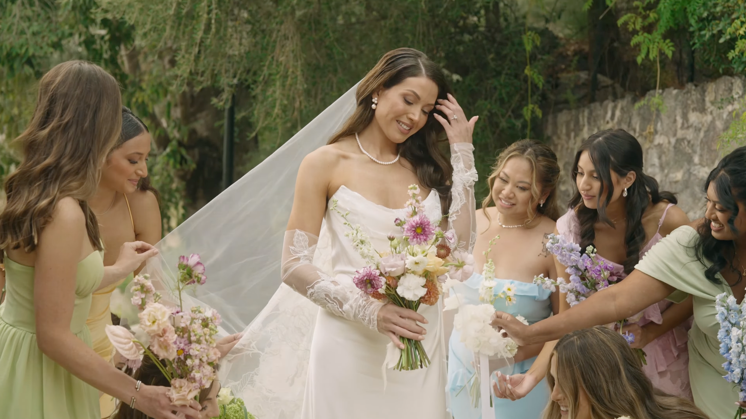 wedding video shot in Finca Comassema in Mallorca. A bride wearing a Vivienne Westwood wedding dress surrounded by her bridemaids