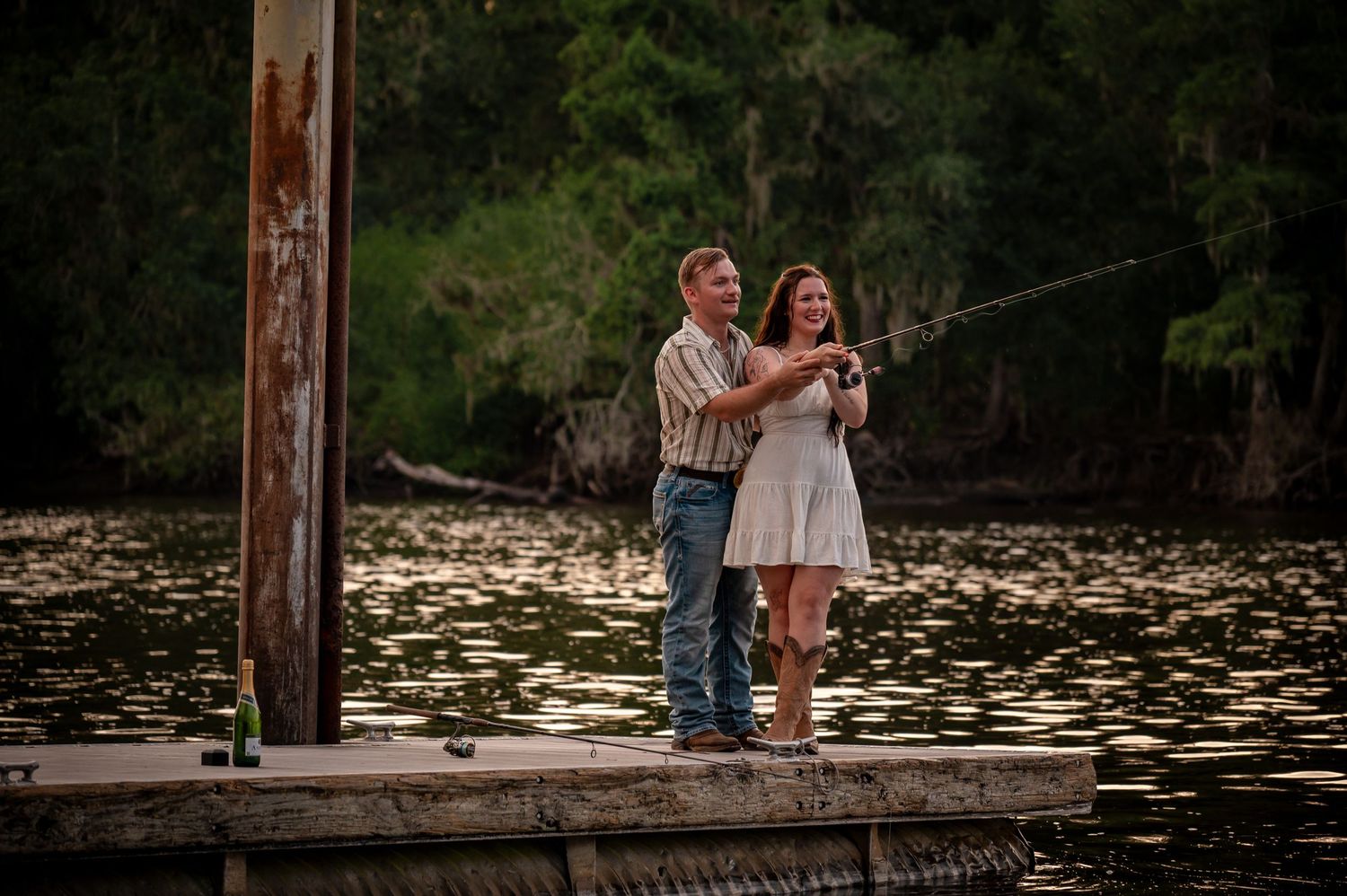 A romantic couple shares an intimate moment at sunset in a dreamy, golden-lit outdoor setting.