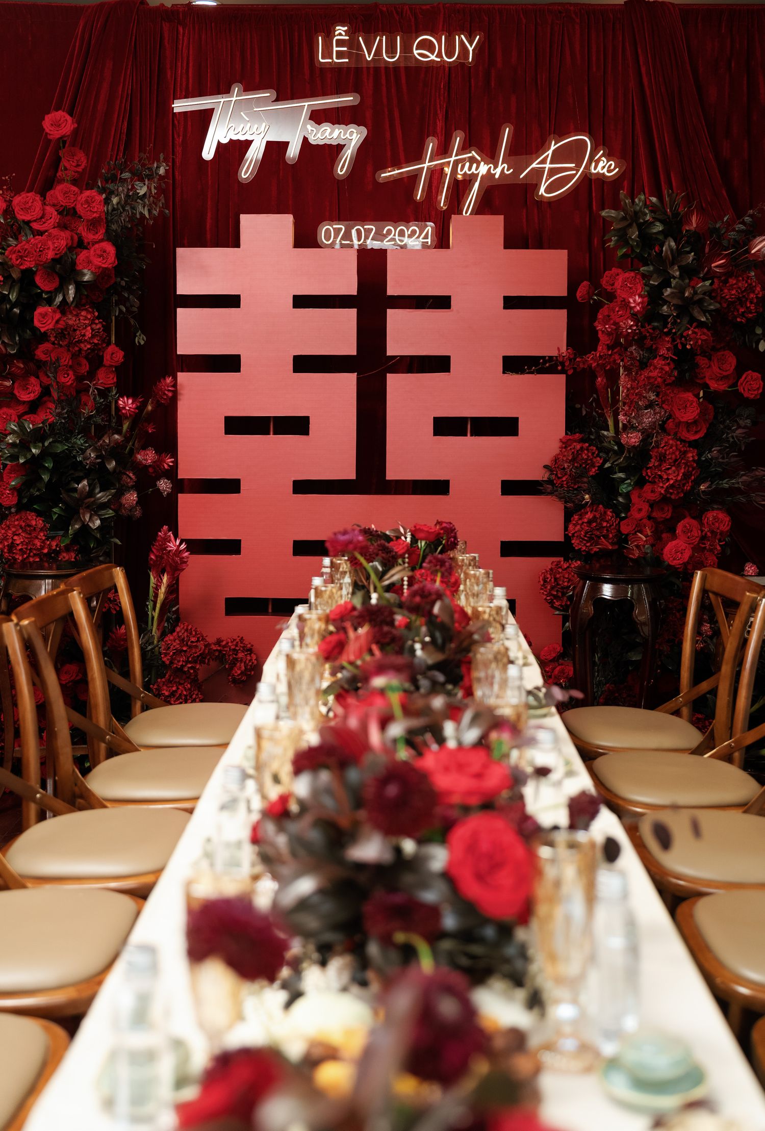Wedding banquet table with red roses and double happiness symbol backdrop dated 07.02.2021.