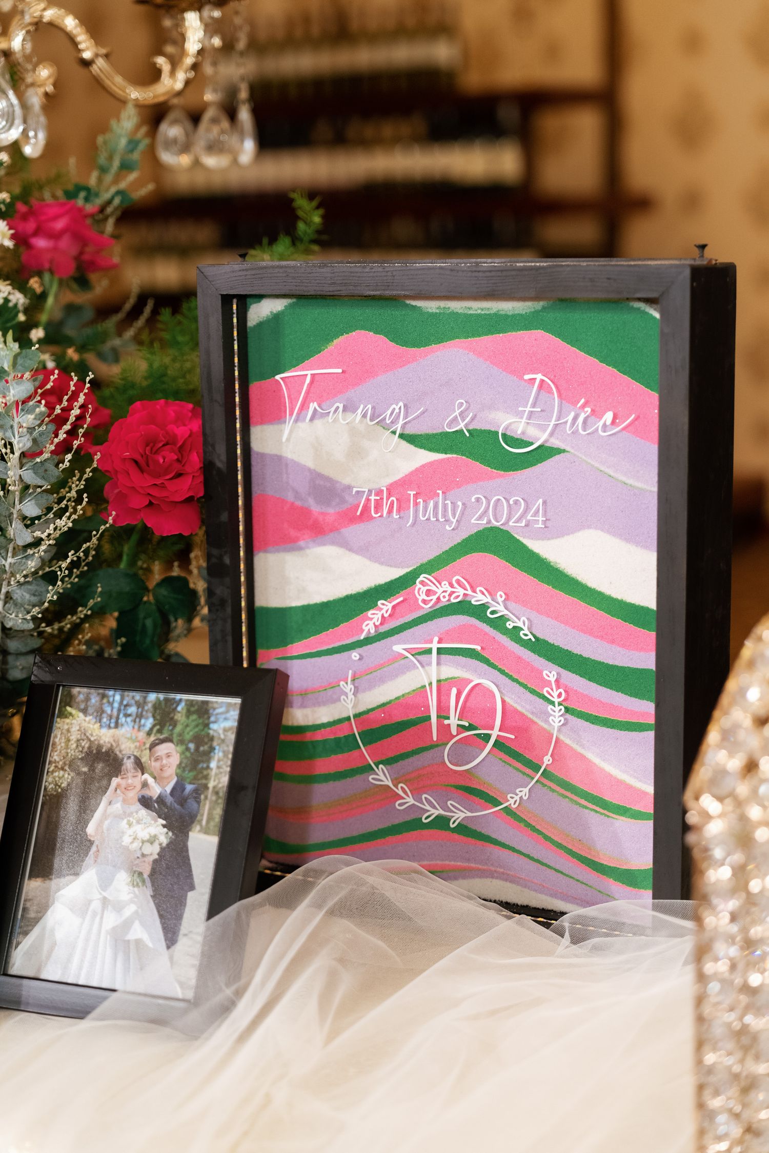 Wedding invitation with watercolor waves design in pink and green.