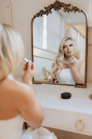 A series of soft, romantic mirror reflections showing wedding preparation moments in a bright interior setting.