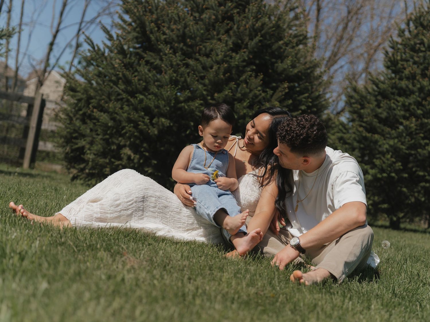 Couple lying on grass in park sharing tender moments in progressive multiple photo sequence.
