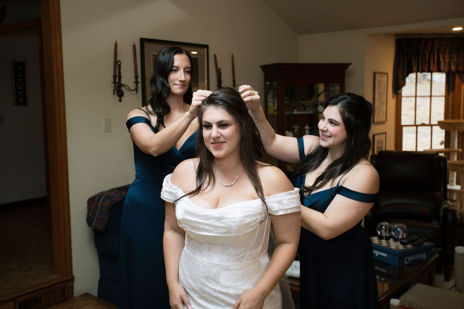 Wedding preparations taking place indoors with elegant decor and natural lighting.