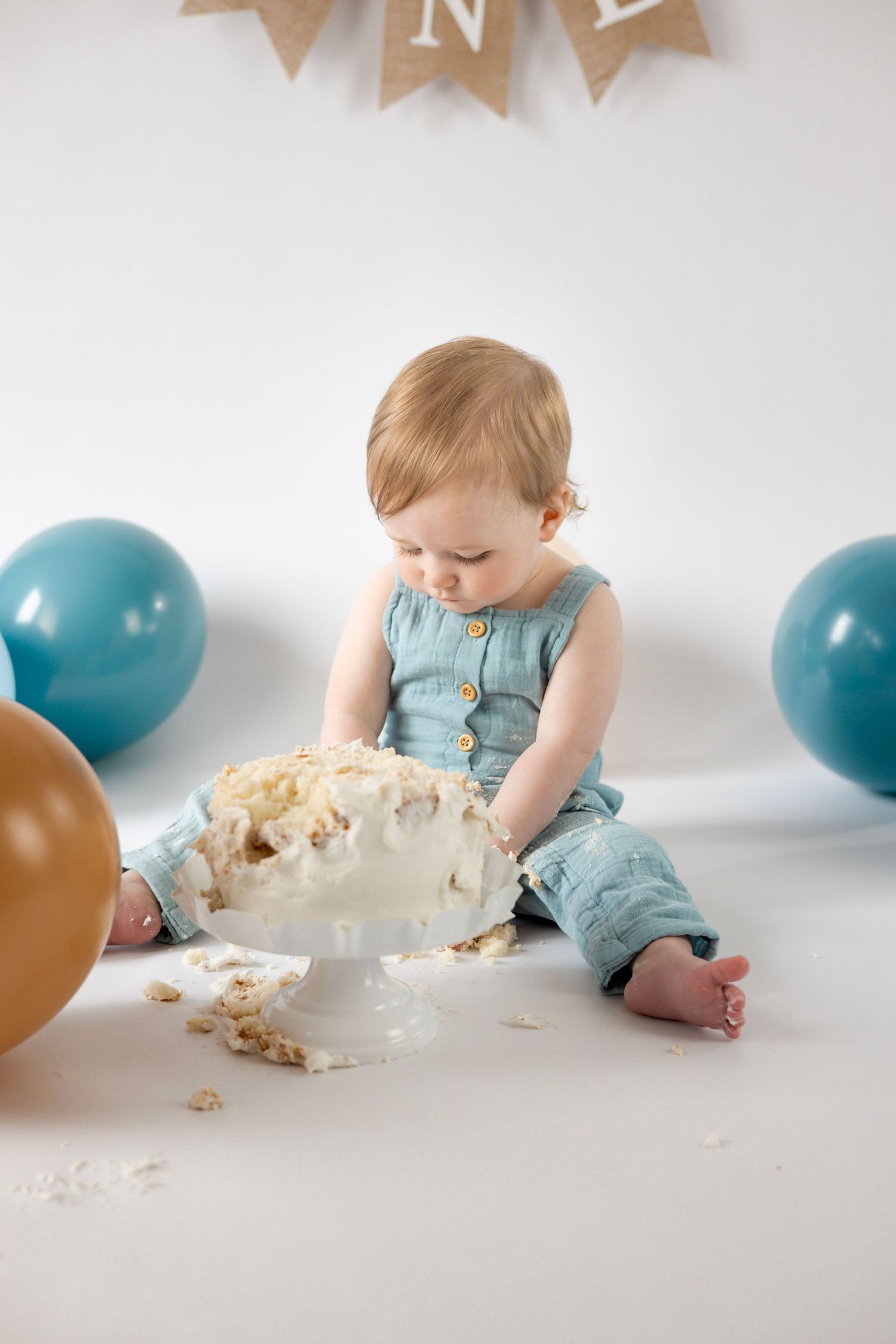Baby celebrating first birthday with cake smash in Waynesboro, photographed during milestone session.