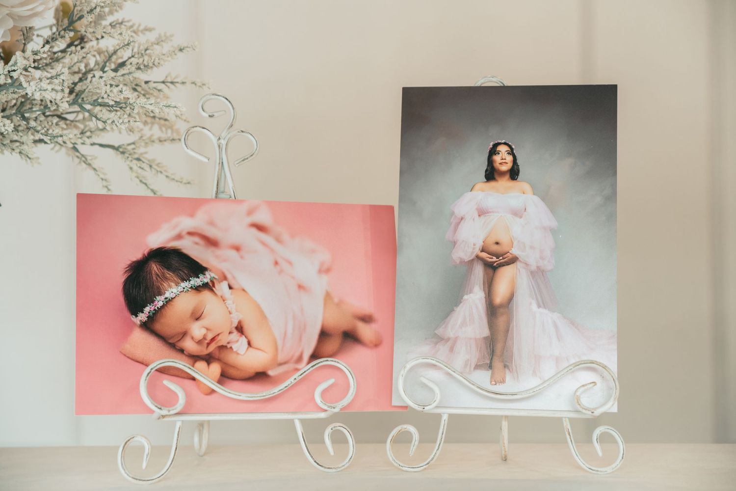 White decorative wall shelves displaying professional photography prints in a studio setting.