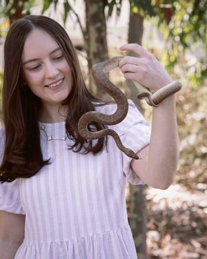 woman with a python around her neck