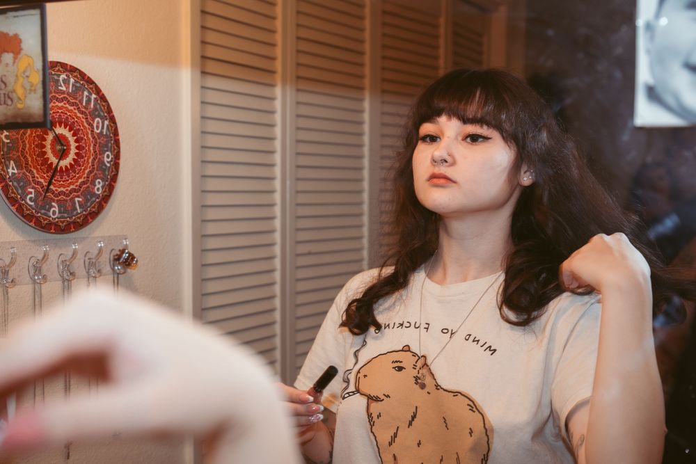 Couple shares playful moments during their wedding photo session indoors.
