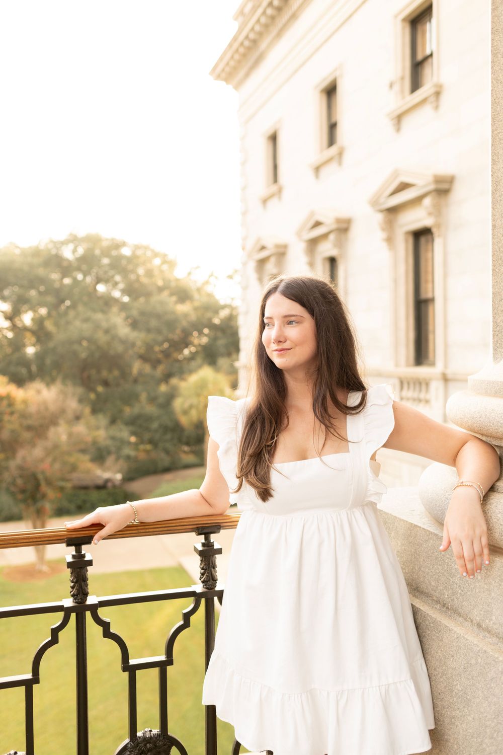 Unique Columbia, SC senior session at the state house during golden hour.
