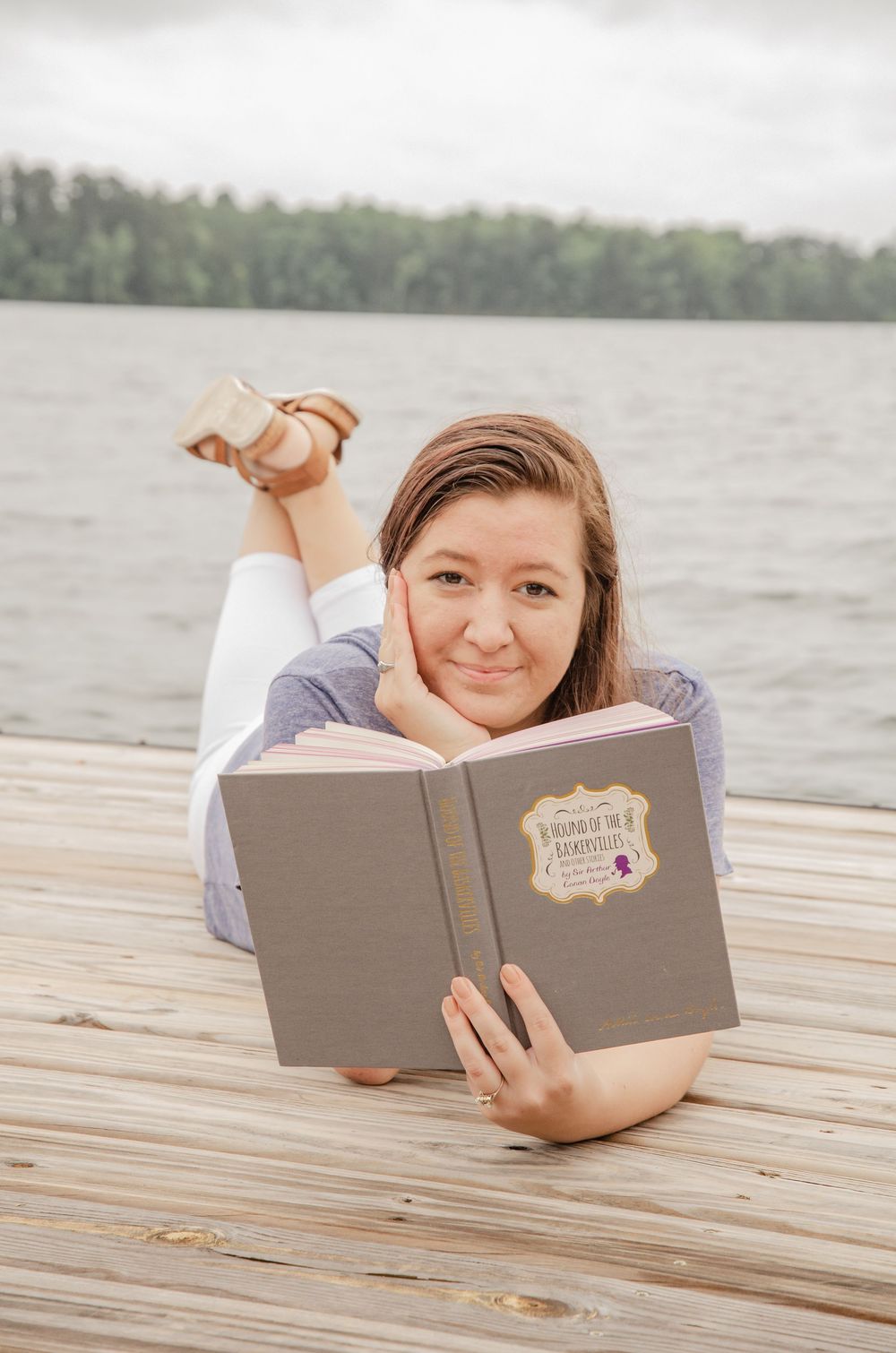 Unique senior session with book at Lake Murray, SC on floating dock.
