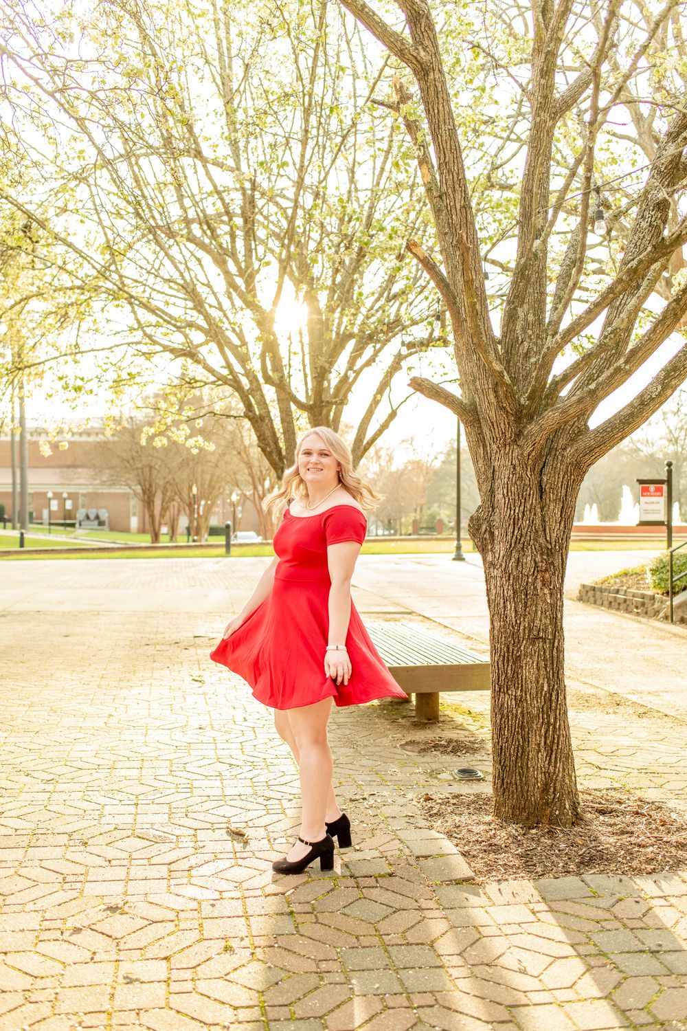 Candid photo of girl at Newberry College senior session during golden hour.