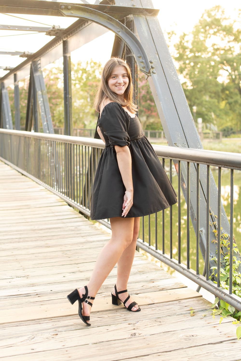 Girl poses for senior session at unique downtown Columbia riverfront location.
