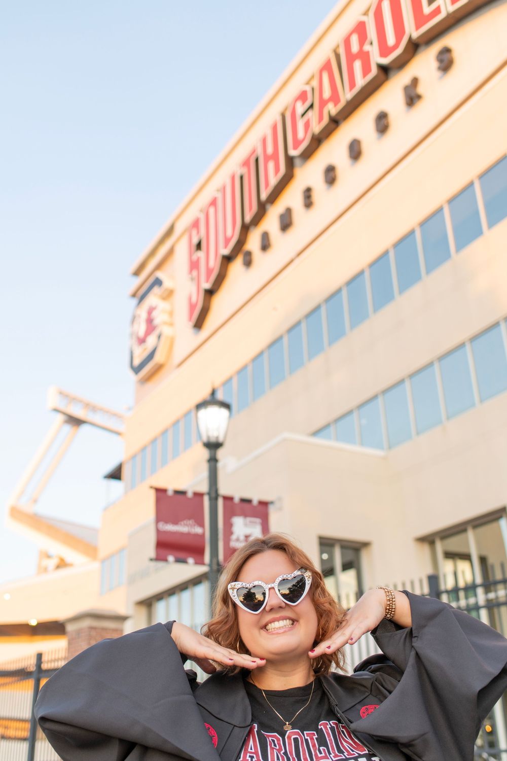 University of South Carolina senior session in Columbia, SC. Girl poses in front of football stadium at USC.