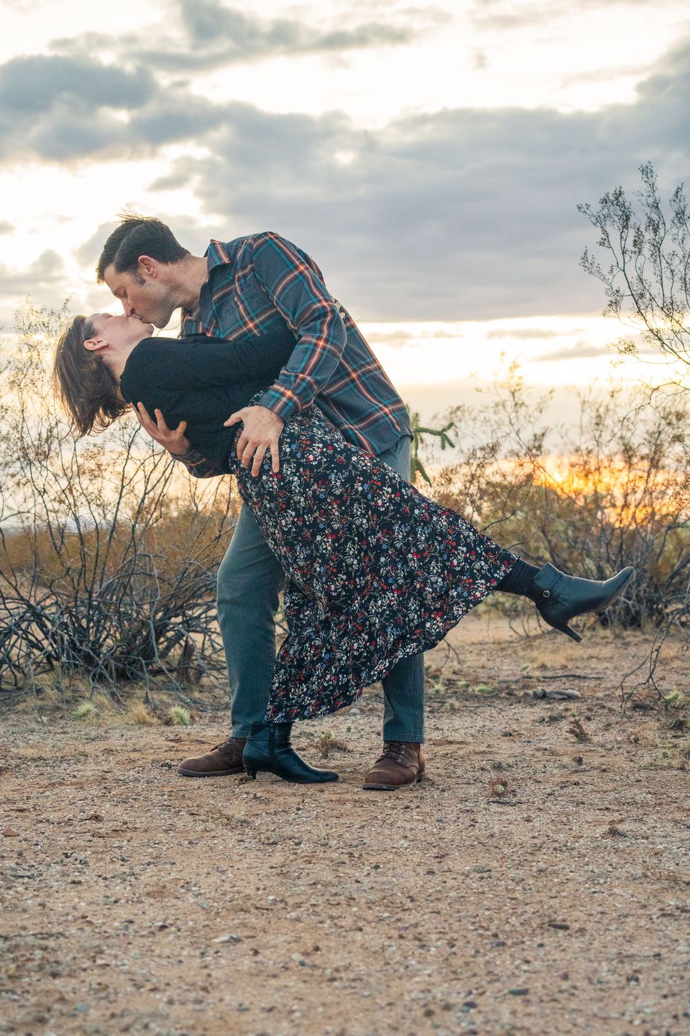A series of photos of a romantic couple embracing against a cloudy sky at sunset. Arizona couples session mountains. Outdoors Arizona