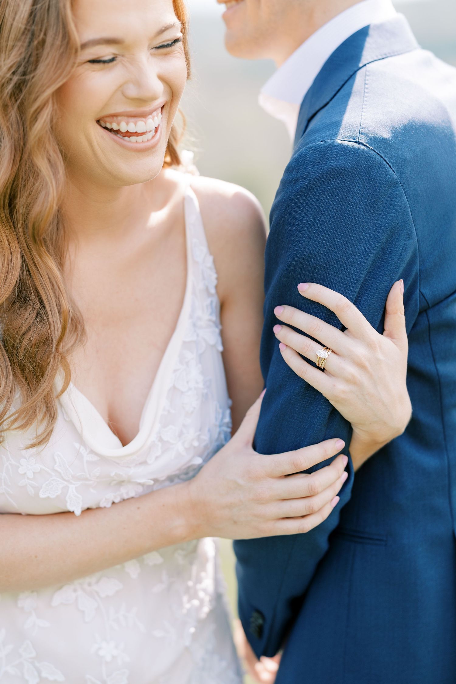 Close-up series of romantic moments between bride in lace dress and groom in navy suit showing gentle embraces and smiles at Pendry Natirar.
