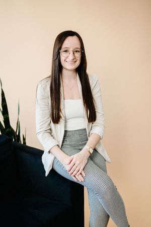 Professional portrait photo series of someone wearing a white top and checkered pants against a neutral beige background.