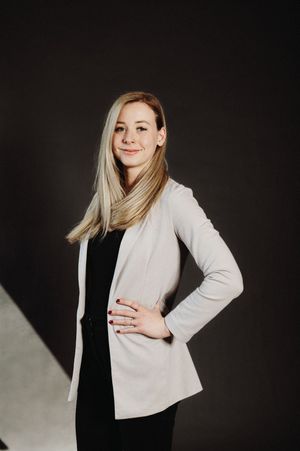 Professional studio portraits of a person in a light colored blazer against a dark background, shown in various poses.