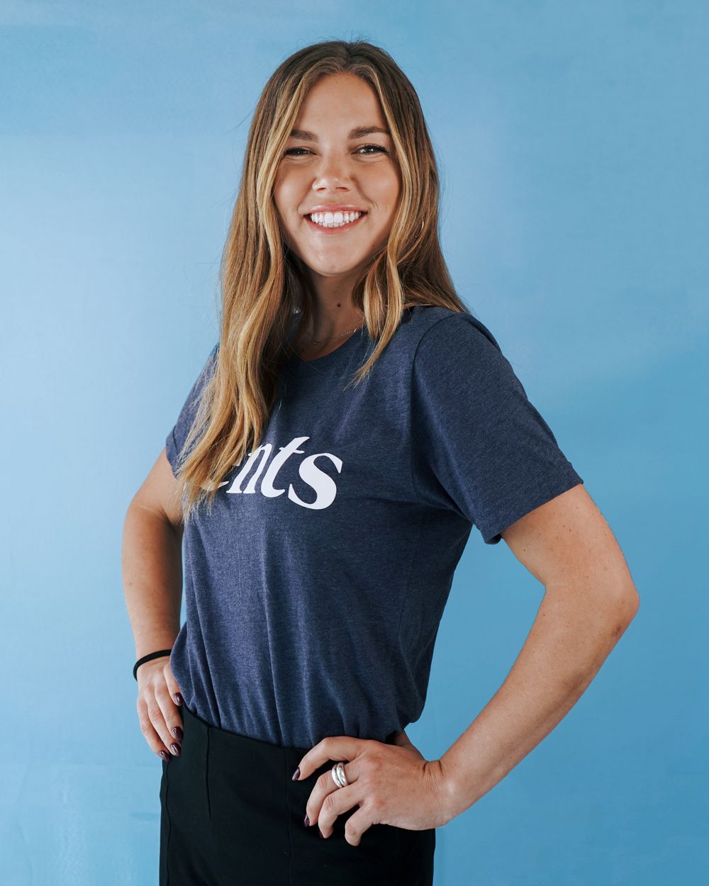 Portrait series showing someone in a navy t-shirt with 'cents' text posing confidently.