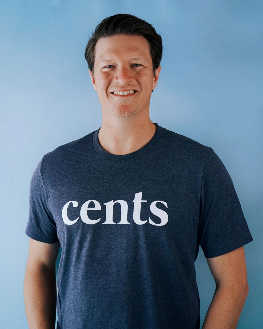 Multiple poses showing someone wearing a dark t-shirt with 'cents' text against a light blue backdrop.