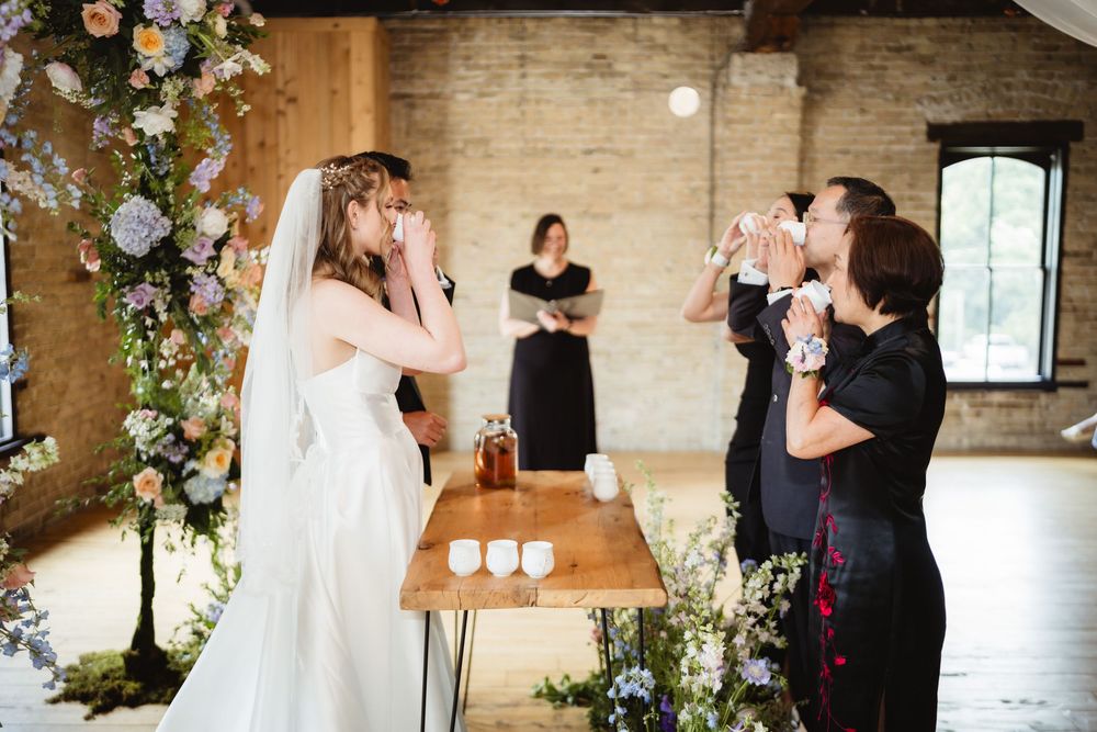 A series of wedding ceremony moments showing intimate exchanges between couples in a rustic brick-walled venue.