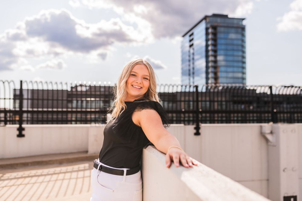 High school senior girl posing on a rooftop in downtown Grand Rapids.