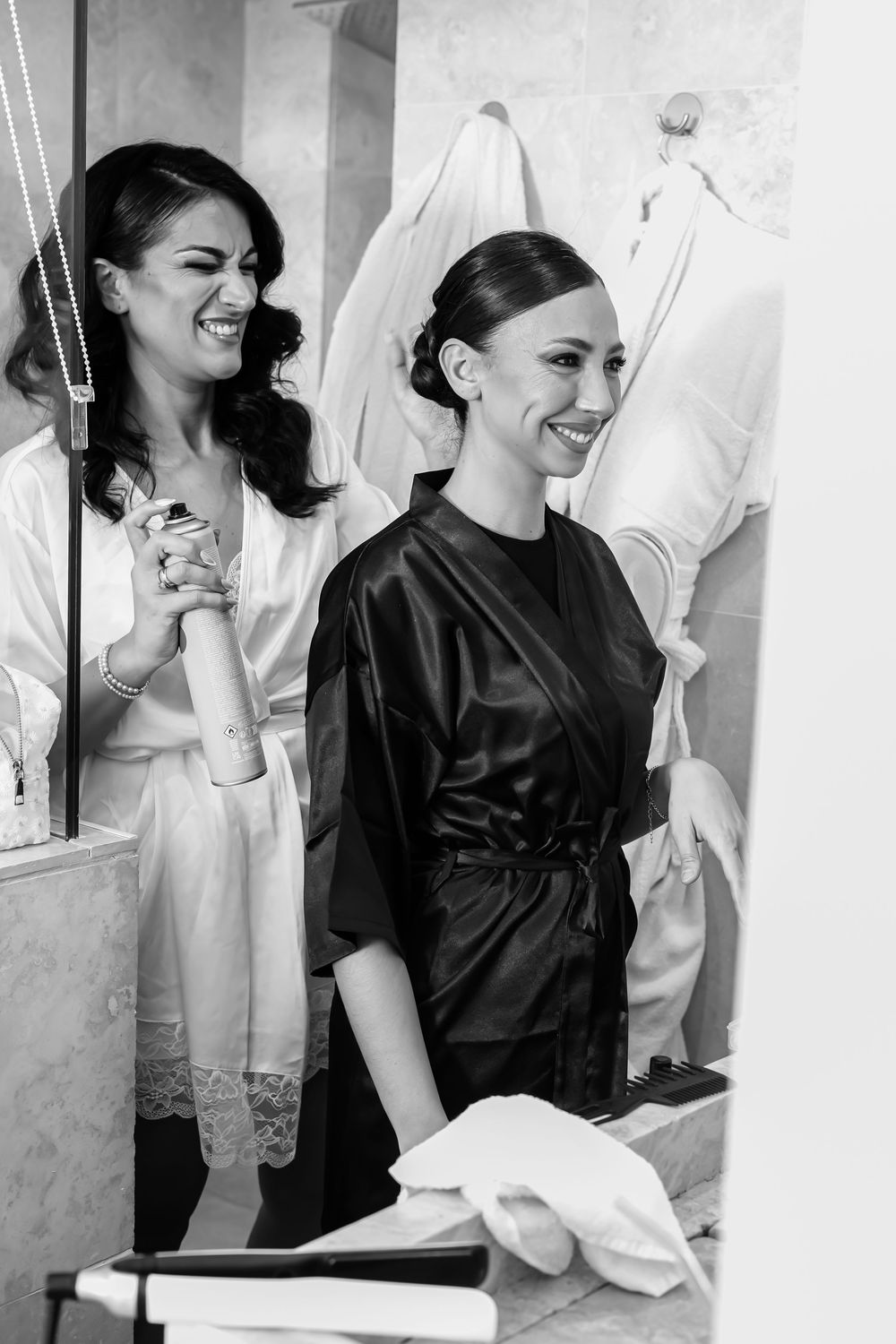 A series of black and white photos showing people in contrasting black and white outfits sharing joyful moments together.